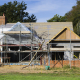Burley,England,A family home under construction. A building site with scaffolding. - Sorglos Bauen GmbH