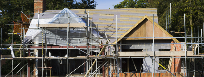 Burley,England,A family home under construction. A building site with scaffolding. - Sorglos Bauen GmbH