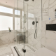 a white bathroom with a shower and a toilet - Sorglos Bauen GmbH