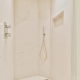 Bathroom with built-in shower head in the shower - Sorglos Bauen GmbH